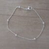 PULSERA DE ACERO BLANCO DE BOLITAS 1 MM CON BOLITAS DE 3 MM INTERCALADAS. LARGO 19 CM