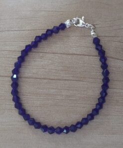 PULSERA DE TANZA CON MOSTACILLAS AZUL Y TERMINAL DE ACERO BLANCO. LARGO 18 CM.