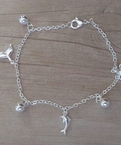 PULSERA DE ACERO BLANCO ESPEJITO CON DIJE DELFIN, COLA DE BALLENA, TORTUGA Y BOLITAS INTGERCALADAS. LARGO 19 CM