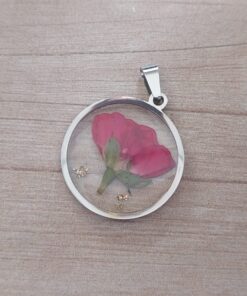 DIJE DE ACERO FLOR BORDO EN RESINA TRANSPARENTE 25 MM