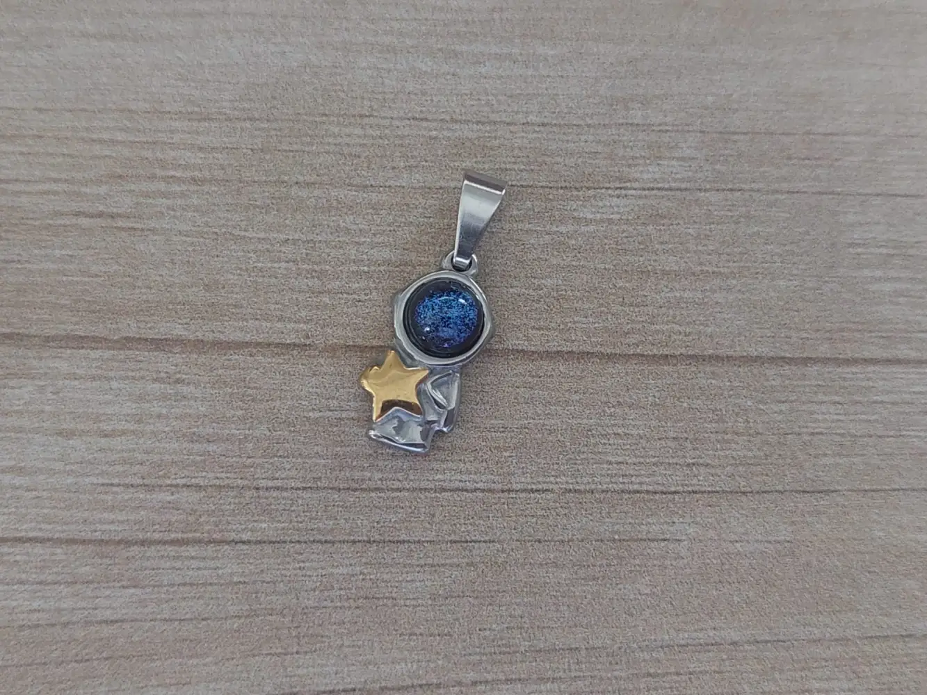 dije de acero astronauta con estrella