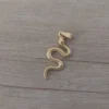 dije de acero dorado vibora