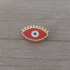 dije de acero dorado ojo