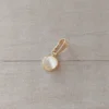 dije de acero dorado pastilla