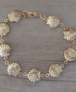 pulseras de acero dorada con ostras