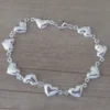 pulsera de acero blanco corazones