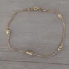 pulsera de acero dorado bolitas