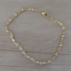 pulsera de acero dorado bolitas