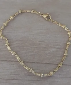 pulsera de acero dorado bolitas