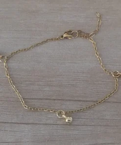 tobillera acero dorado con bolitas