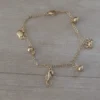 pulsera de acero dorado dijes marinos