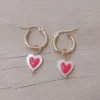 Aro de acero dorado argolla con corazón colgante bicolor