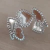 Esclava regulable de acero con corazones y bolitas alrededor