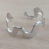 Esclava regulable de acero en forma irregular