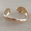 Esclava regulable de acero dorado irregular