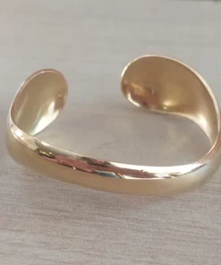Esclava regulable de acero dorado irregular
