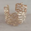 Esclava regulable de acero dorado