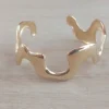 Esclava regulable de acero dorado irregular