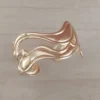 Esclava regulable de acero dorado ondas irregulares