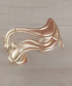 Esclava regulable de acero dorado ondas irregulares