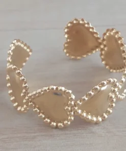 Esclava regulable de acero dorado con corazones y bolitas alrededor