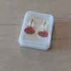 Abridor acero dorado frutilla