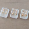 Abridor acero dorado bolita