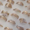 ANILLOS DE ACERO DORADO VARIOS STRASS X 36 UNIDADES SURTIDOS EN MEDIDAS Y MODELOS. (MEDIDAS DEL 17 AL 21)