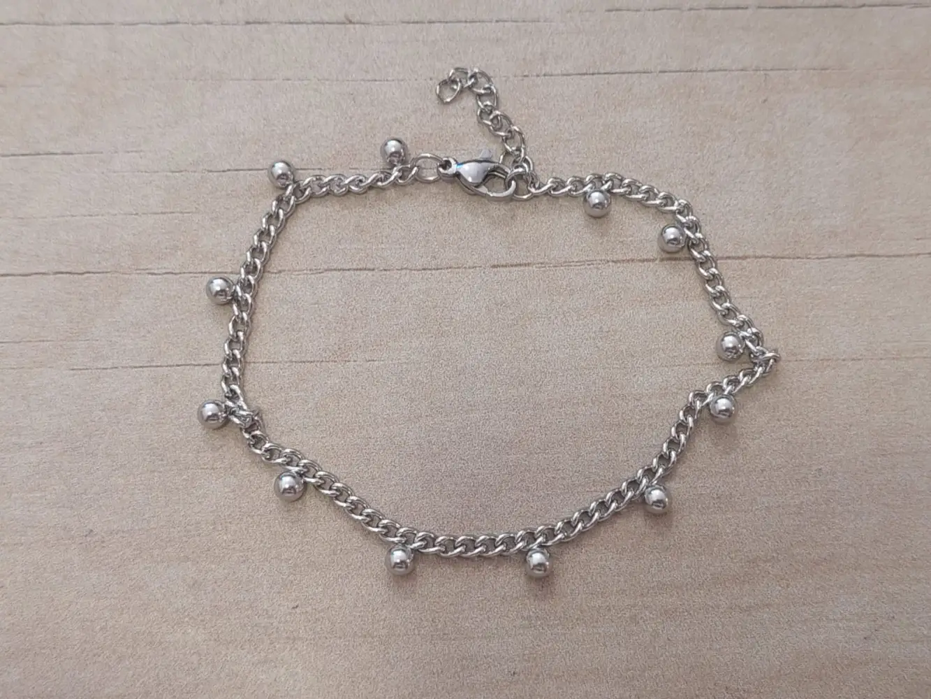 PULSERA DE ACERO GRUMET CON BOLITAS SOLDADAS. LARGO 18,5 + EXT. 3 CM.