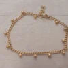 PULSERA DE ACERO DORADO GRUMET CON BOLITAS SOLDADAS. LARGO 19 + 2,5 CM.