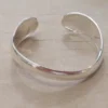 PULSERA DE ACERO BLANCO ESCLAVA ABIERTA IRREGULAR