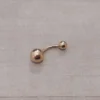 Piercing acero dorado