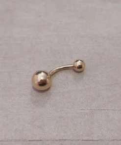 Piercing acero dorado