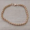Pulsera de acero dorado espiga