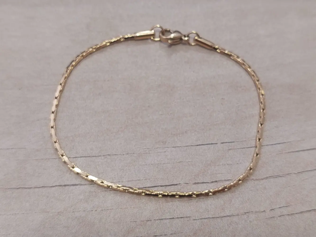 Pulsera de acero dorado cardano