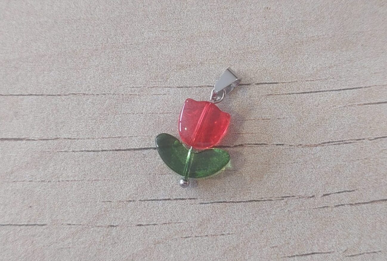 Dije de acero tulipan