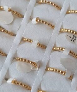 CAJA DE ANILLOS DE ACERO DORADO