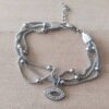 PULSERA DE ACERO MALLA TUBULAR TEJIDA TRIPLE CON BOLITAS Y DIJE OJO CON STRASS. LARGO 17,5 CM + 4 CM DE EXT.