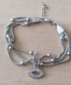 PULSERA DE ACERO MALLA TUBULAR TEJIDA TRIPLE CON BOLITAS Y DIJE OJO CON STRASS. LARGO 17,5 CM + 4 CM DE EXT.