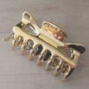 PACK X 12 BROCHES DE PLASTICO DORADO. TAMAÑO 90 X 50 MM