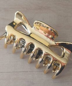 PACK X 12 BROCHES DE PLASTICO DORADO. TAMAÑO 90 X 50 MM