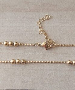 CADENA DE ACERO DORADO BOLITA 2.4 CON BOLITAS 3 MM INTERCALADAS DE A TRES.
