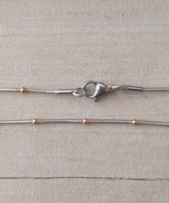 CADENA DE ACERO CLAPTON 1.2 COMBINADA CON BOLITAS DORADS 1 MM. LARGO 50 CM