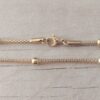 CADENA DE ACERO DORADO MALLA TUBULAR CON BOLITAS INTERCALADAS DE 4 MM