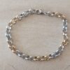 PULSERA DE ACERO ROLO 6.0 COMBINADA. LARGO 20 CM