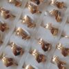 ANILLOS DE ACERO DORADO FIGURA CALADA LOVE X 36 UNIDADES. (MEDIDAS DEL 16 AL 20)