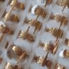 ANILLOS DE ACERO DORADO FIGURA CALADA LIBELULA X 36 UNIDADES. (MEDIDAS DEL 16 AL 20)