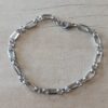 PULSERA DE ACERO ESLABÓN ALARGADO COMBINADO CON TRES ESLABONES ROLO. LARGO TOTAL 22 CM