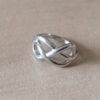 ANILLO DE ACERO INFINITO ENTRELAZADO CERRADO