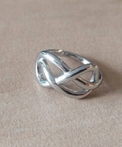 ANILLO DE ACERO INFINITO ENTRELAZADO CERRADO